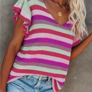 Adorable pastel, ruffle sleeve, crochet sweater top.
